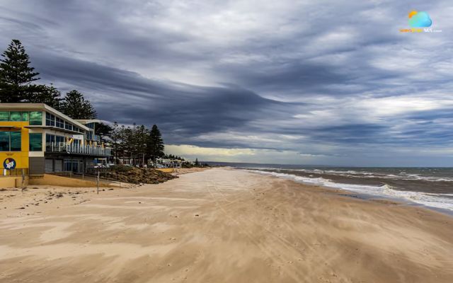 Storm clouds over Henley Beach amid coastal warning