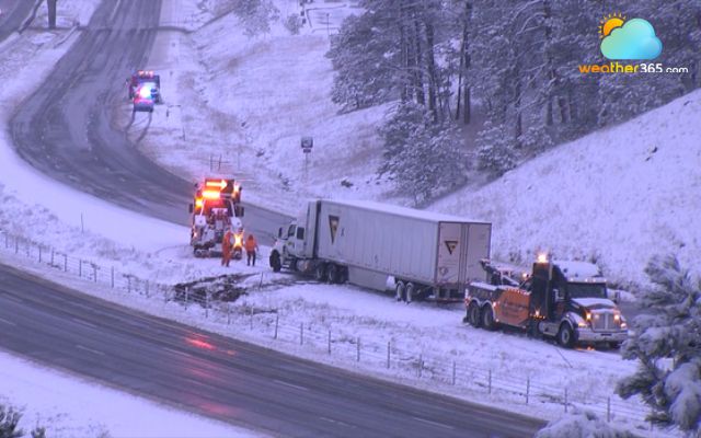 A jackknifed semi-truck on Interstate 70 near Evergreen Parkway