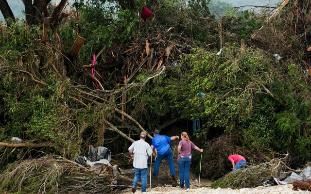  People sought through the debris along the Guadalupe River