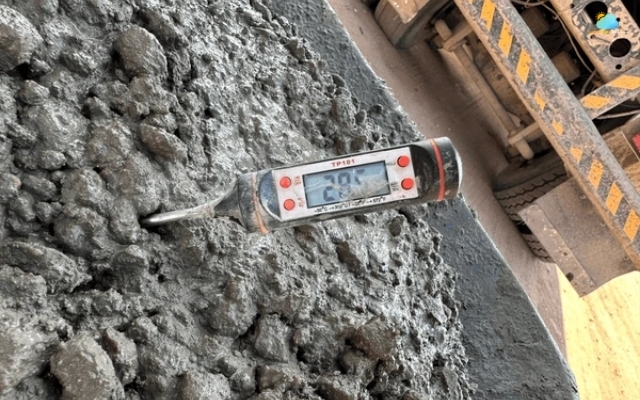 The thermometer is placed above a concrete surface