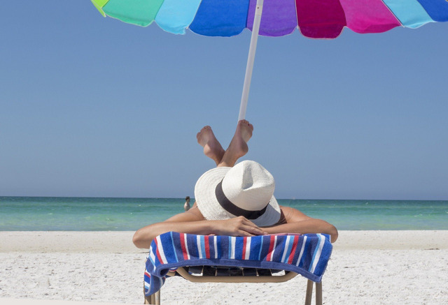 Tan under an umbrella