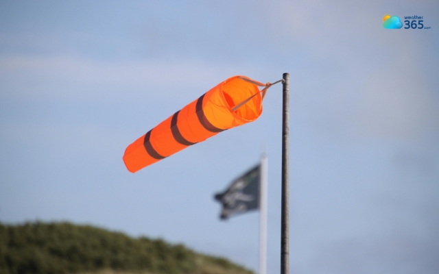 A windsock indicates wind direction and relative wind speed