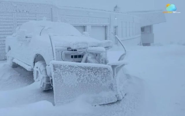 A truck is covered with ice and snow at Mount Washington